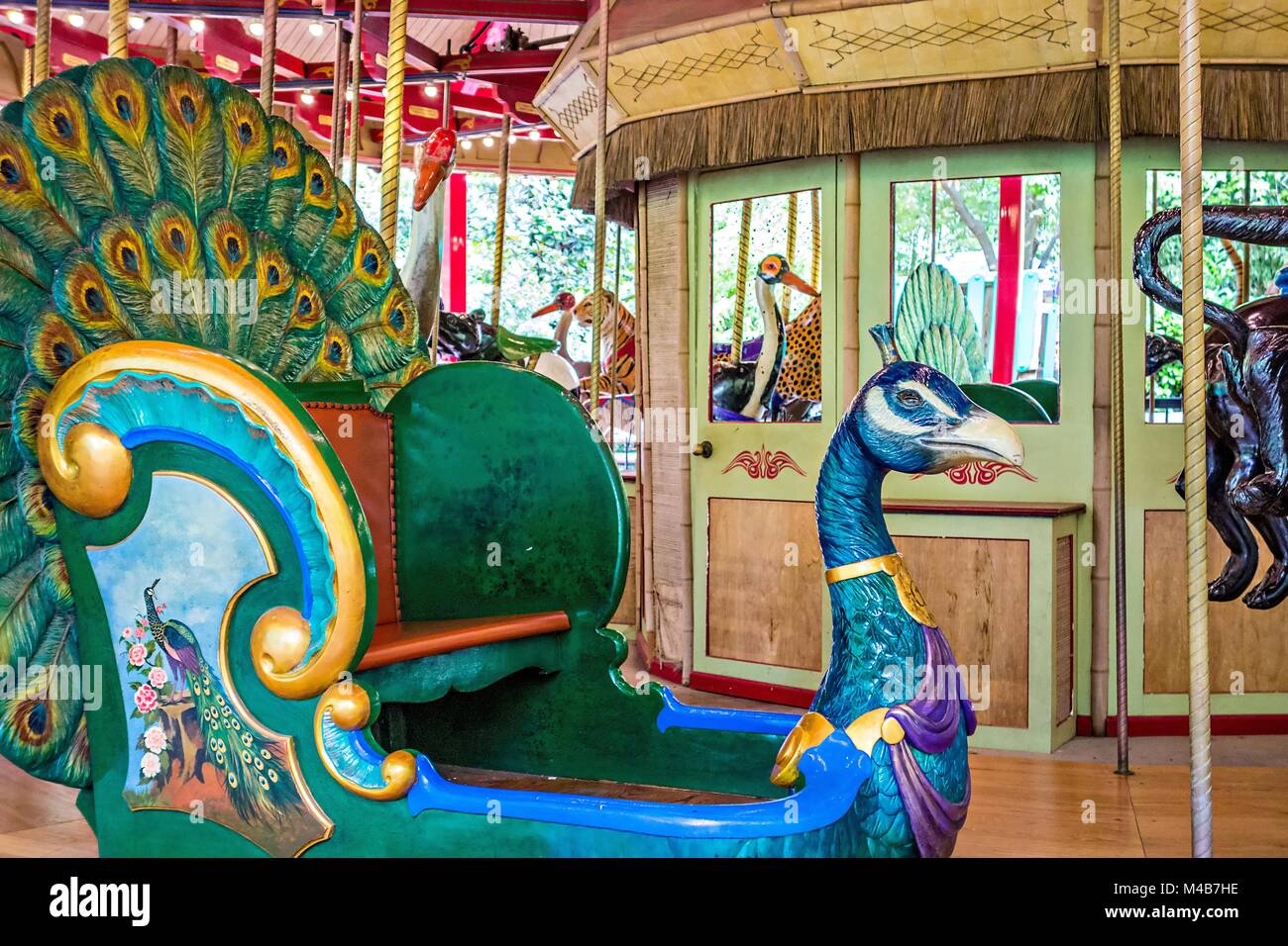 colorful carousel ready to take children for a ride Stock Photo - Alamy