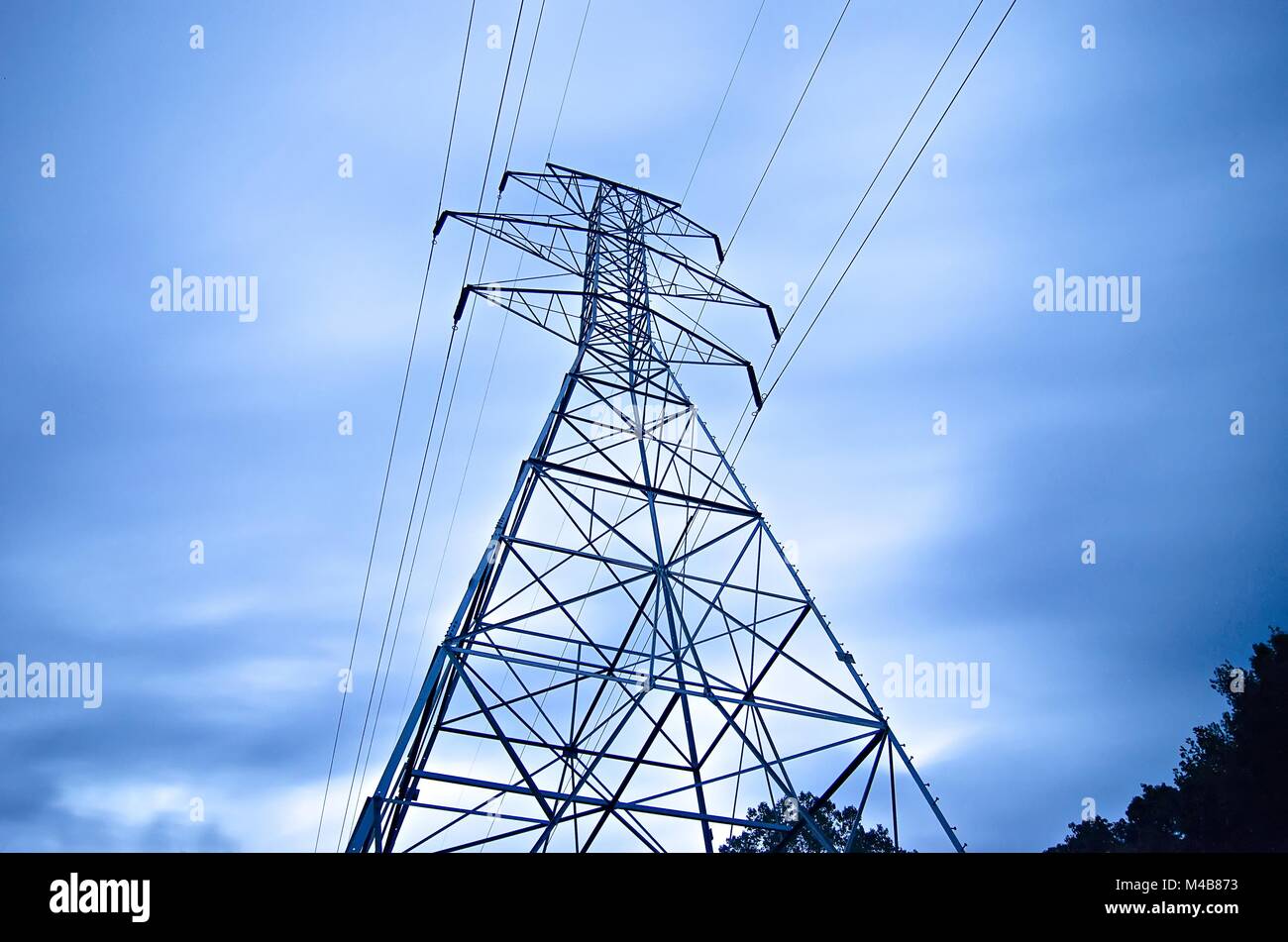 high voltage carrier power lines through the forest Stock Photo - Alamy
