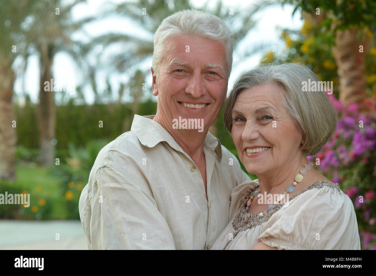 beautiful caucasian senior couple in the park Stock Photo - Alamy