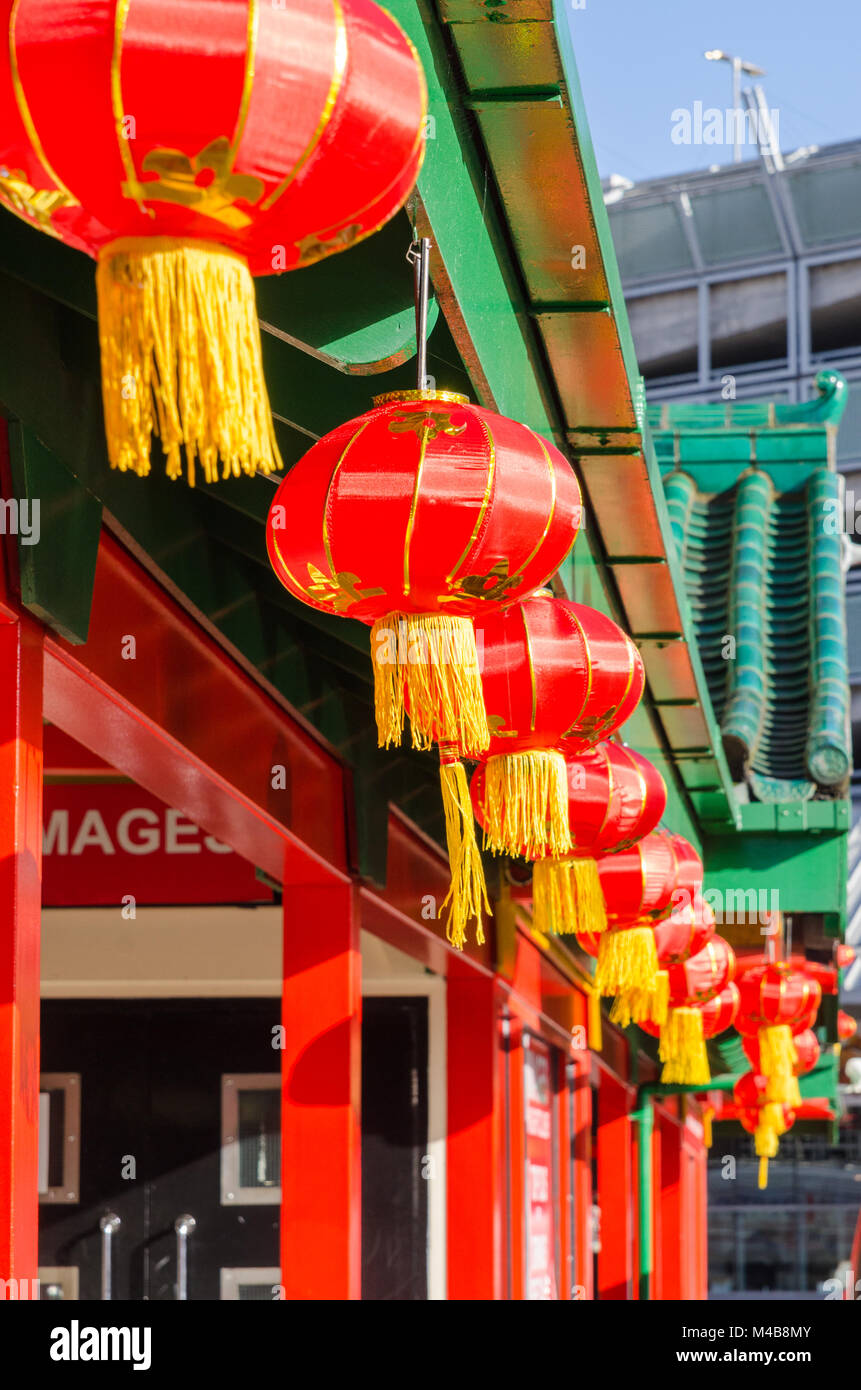 Colourful Chinese lanterns hanging outside shops and restaurants in Birmingham's Chinese Quarter Stock Photo