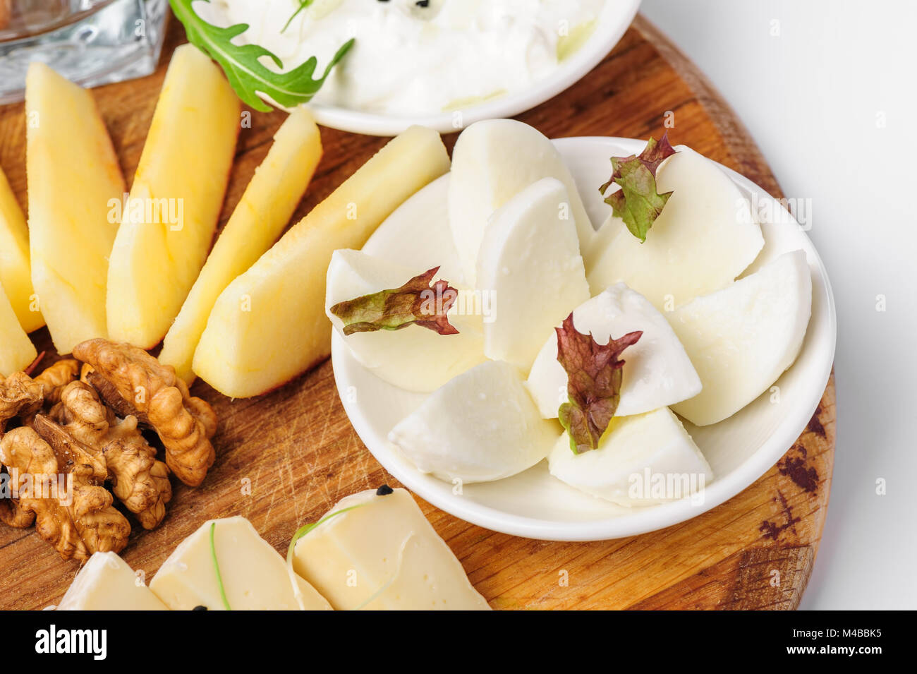 Assorted cheeses and wallnuts Stock Photo