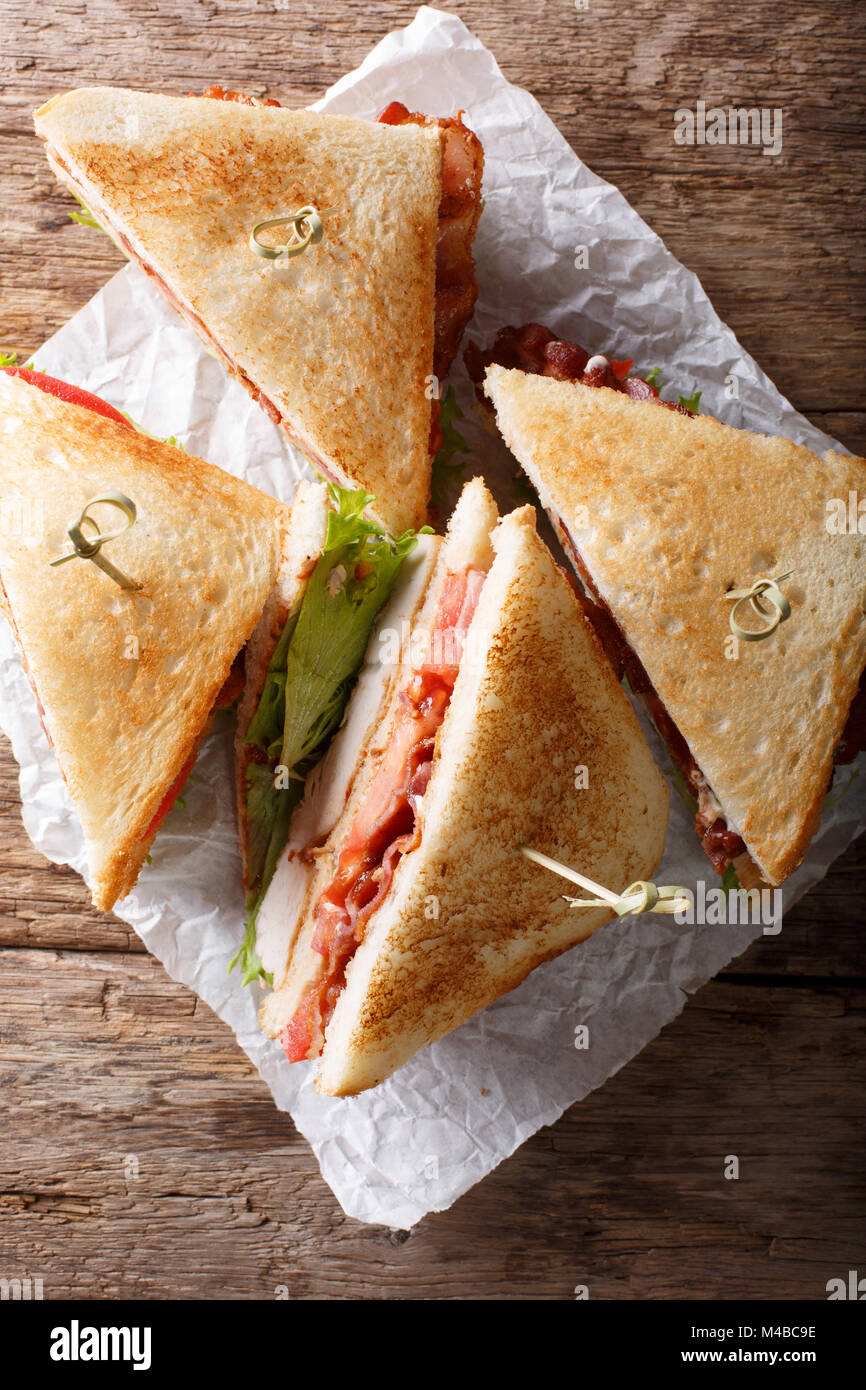 layer club sandwich with turkey meat, bacon, tomatoes and lettuce macro