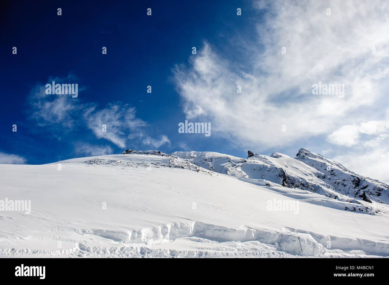 Alpine winter mountain landscape. French Alps with snow Stock Photo - Alamy