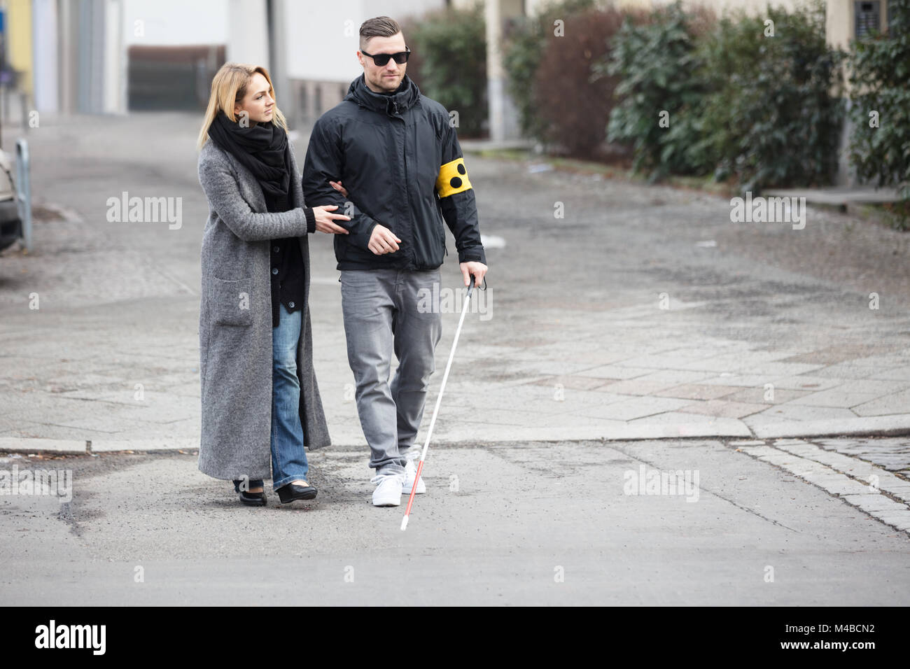 Helping blind person cross road hires stock photography and images Alamy