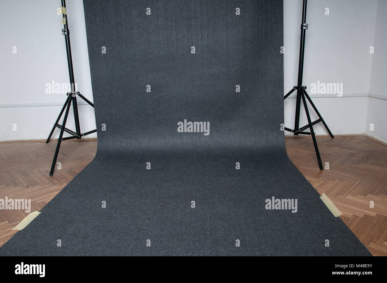 Studio background grey color on the floor hanging on photo racks Stock ...