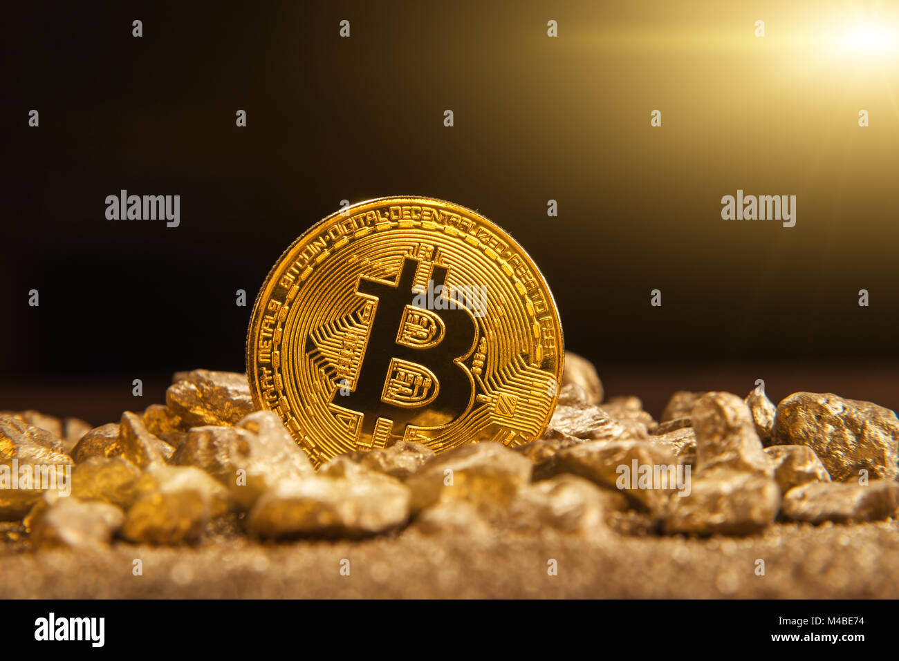 Bitcoin over mound of gold, bitcoin cryptocurrency concept Stock Photo