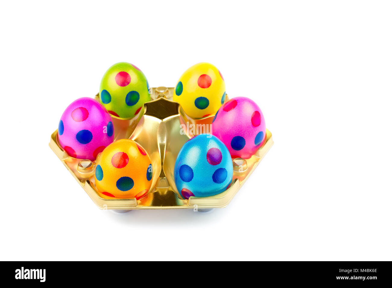 Several painted easter eggs in gold tray Stock Photo - Alamy