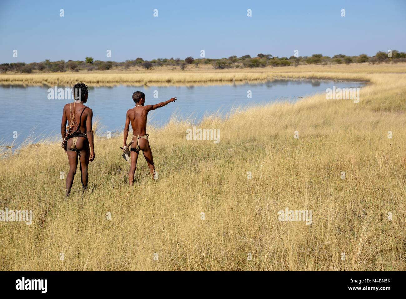 Bushmen of the Ju/' Hoansi-San at a traditional hunt,village //Xa/oba,near Tsumkwe,Otjozondjupa region,Namibia Stock Photo