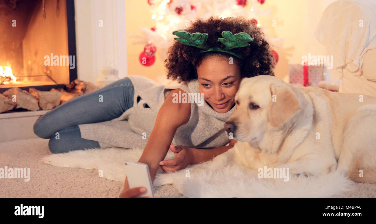 Cute young woman taking a selfie with her dog Stock Photo - Alamy
