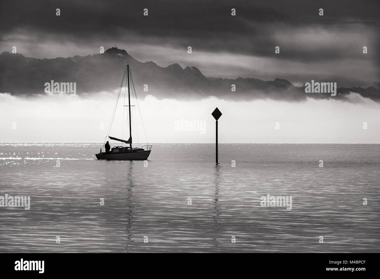 Monochrome image of a single boat sailing Stock Photo
