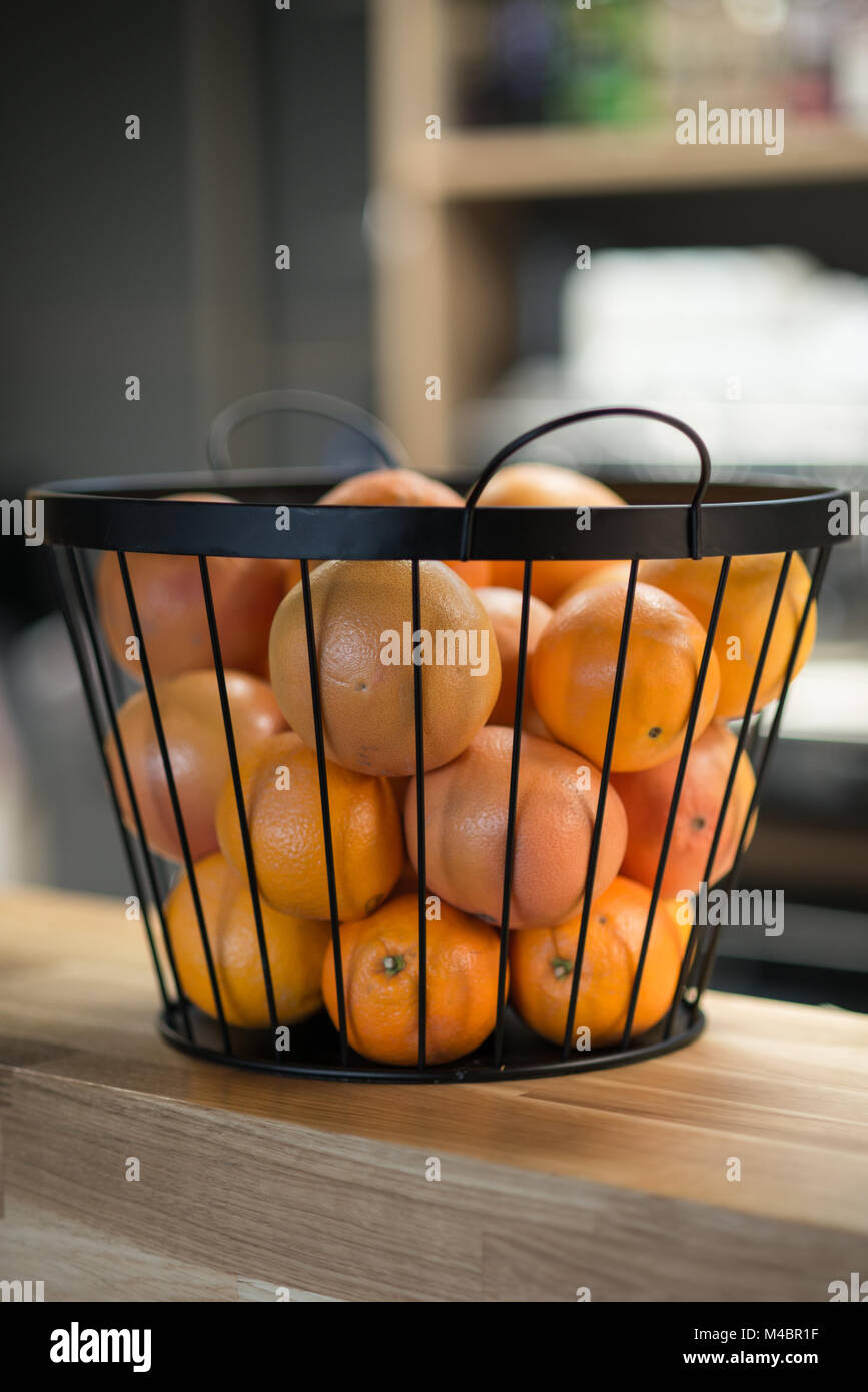 Basket full of oranges in the restaurant bar Stock Photo Alamy