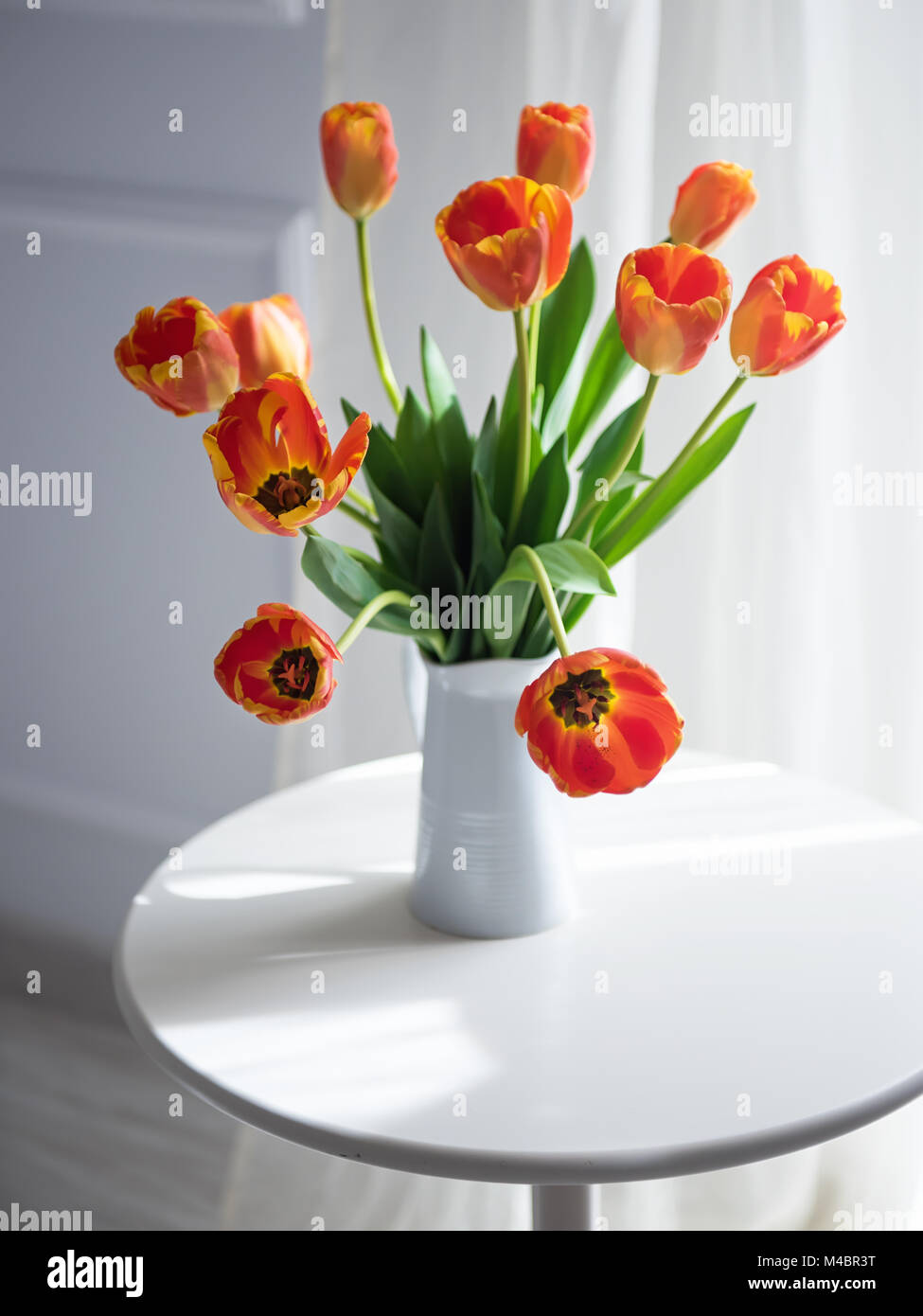 Front View Orange Juice Vase Pink Tulips Table Modern Kitchen Stock Photo  by ©EdZbarzhyvetsky 190380286