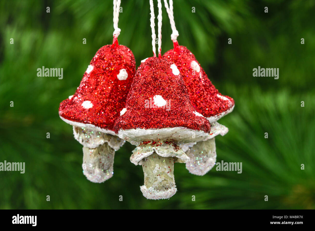 Mushrooms amanita, vintage decoration on a Christmas tree background Stock Photo