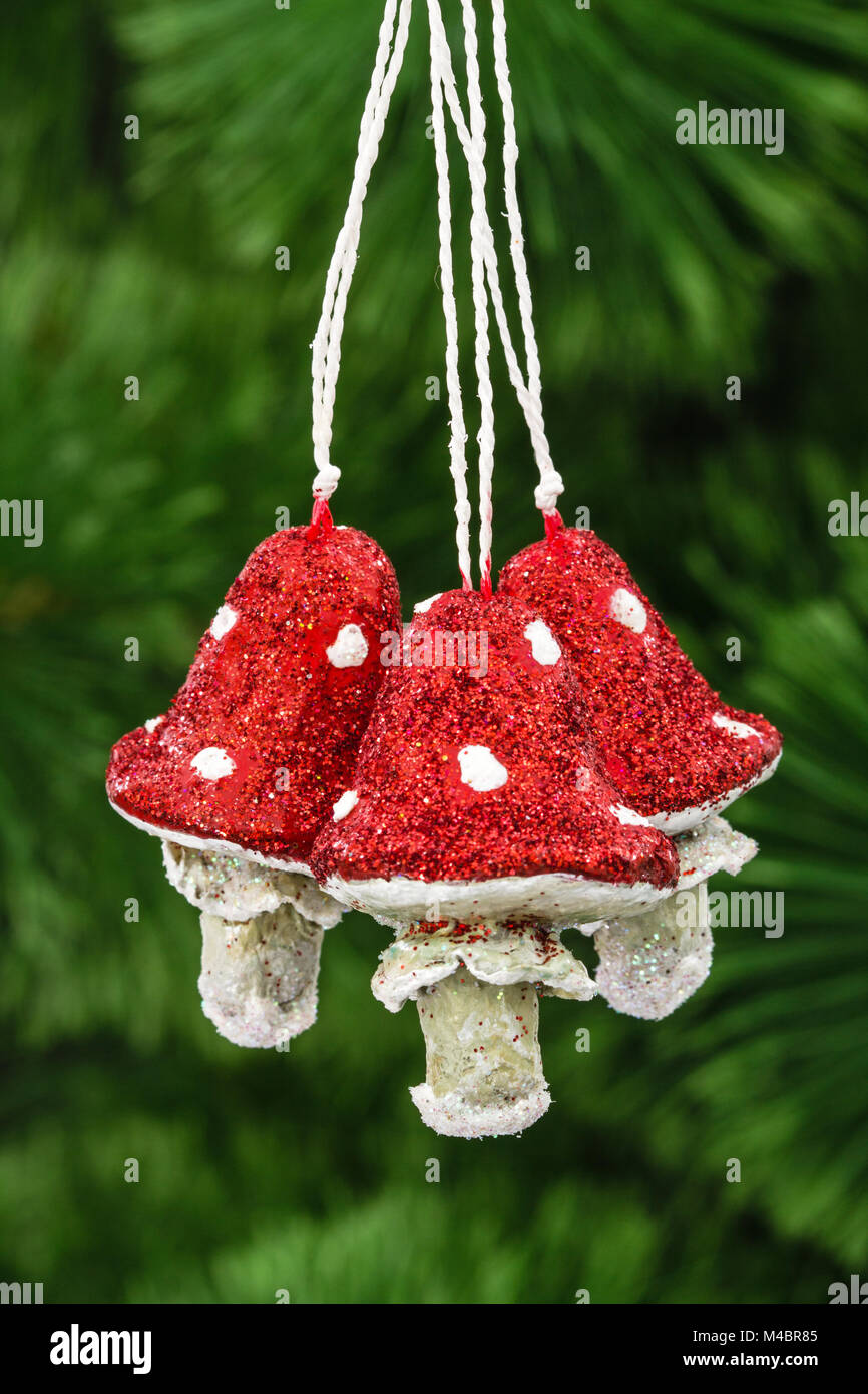 Mushrooms amanita, vintage decoration on a Christmas tree background Stock Photo