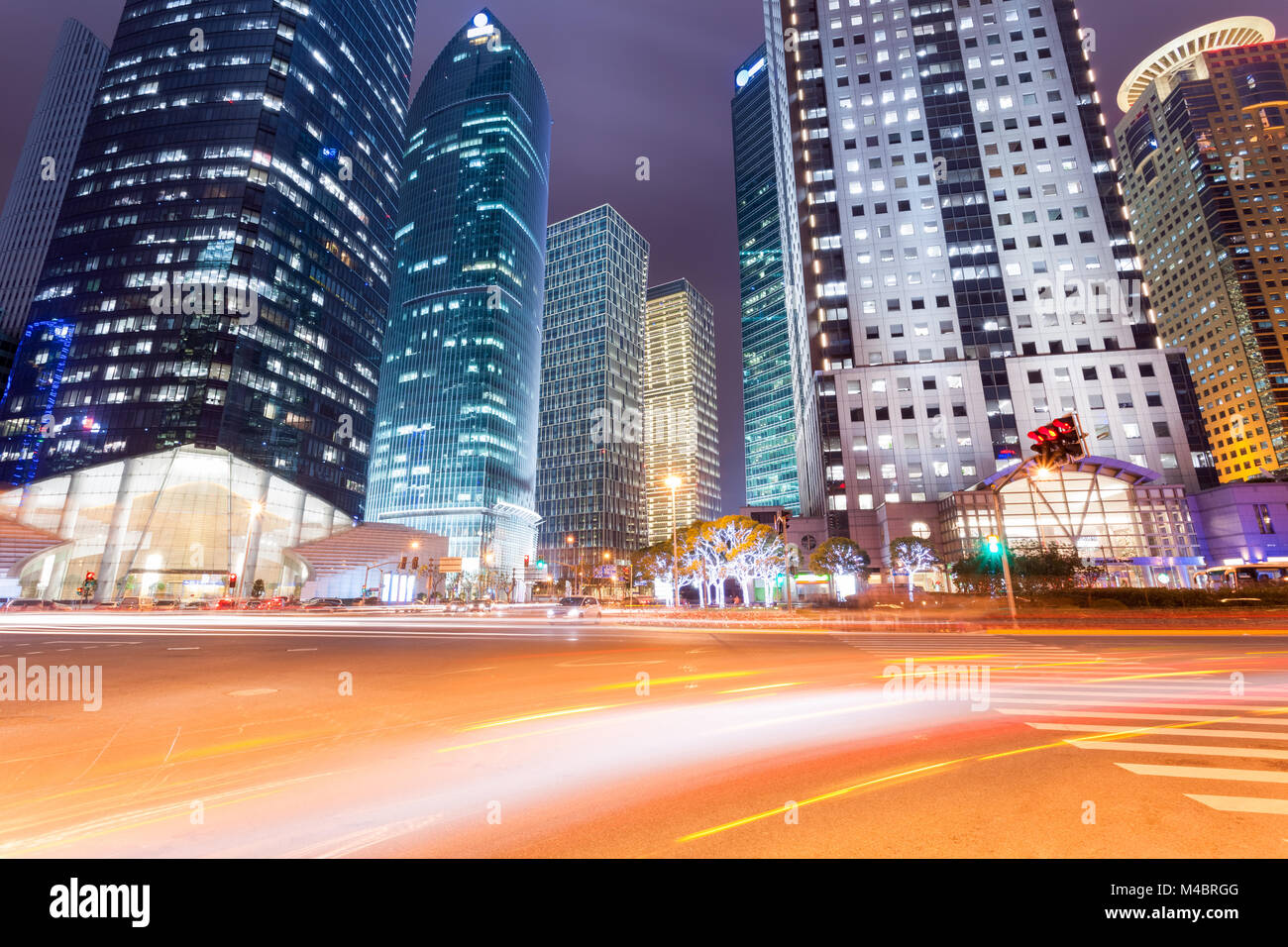 night view of city road with modern buildings in shanghai Stock Photo