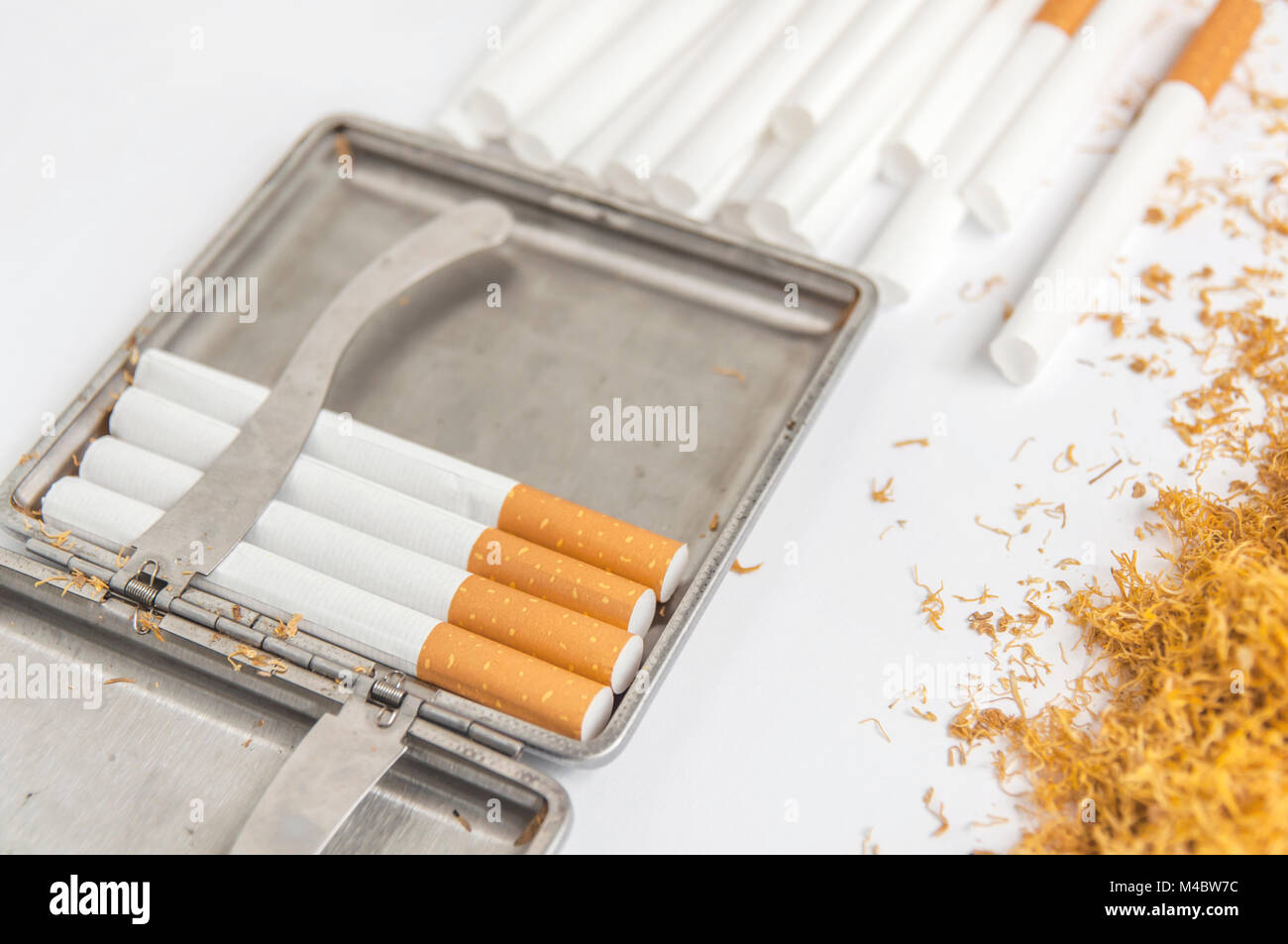 Cigarette metal box for tobacco and paper rolling cigarette Stock Photo