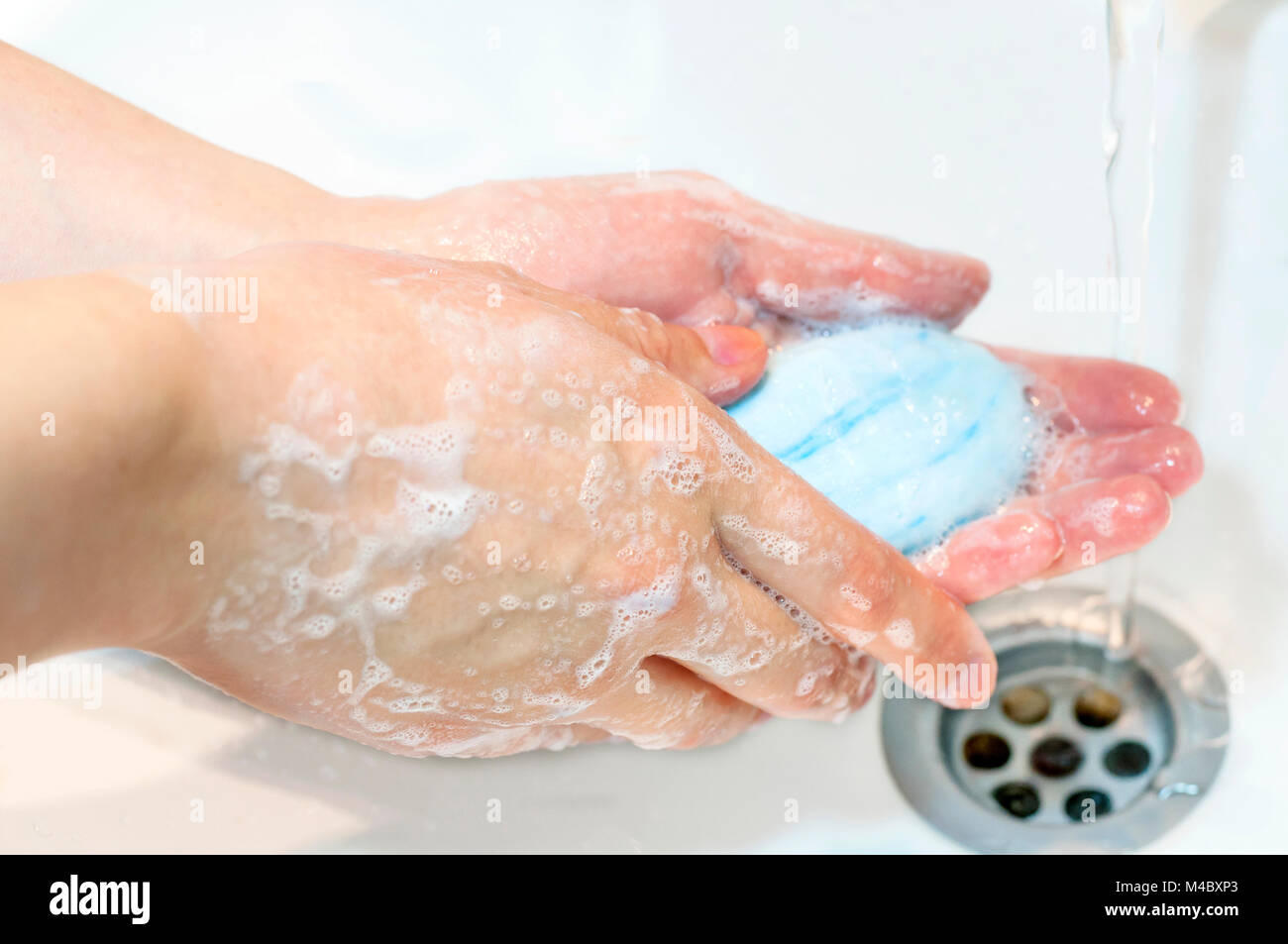 Washing of hands with soap under running water Stock Photo - Alamy