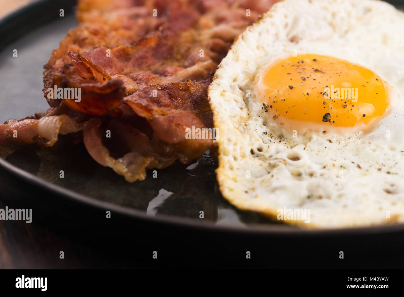 Fried Egg And Bacon Rashers Stock Photo Alamy
