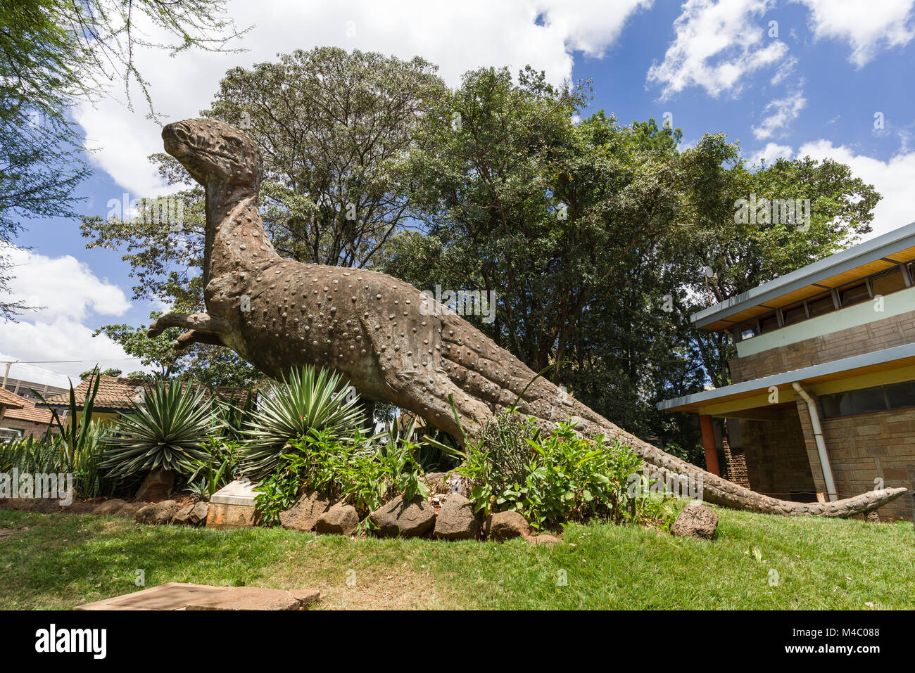 A large sculpture of a dinosaur in the gardens outside the Nairobi