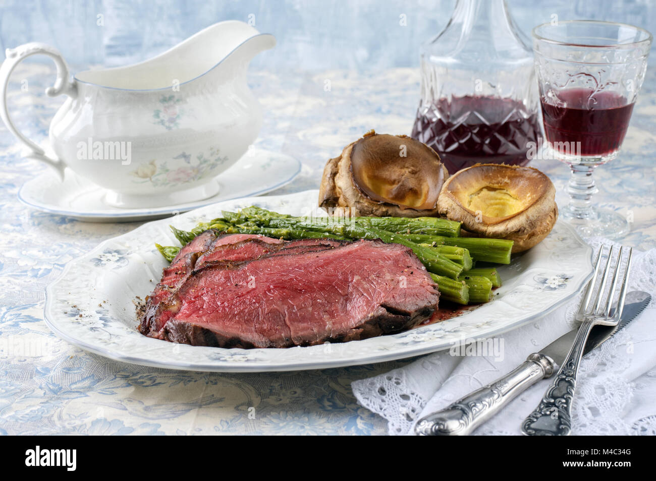 Roast Beef with Green Asparagus and Yorkshire Pudding Stock Photo Alamy