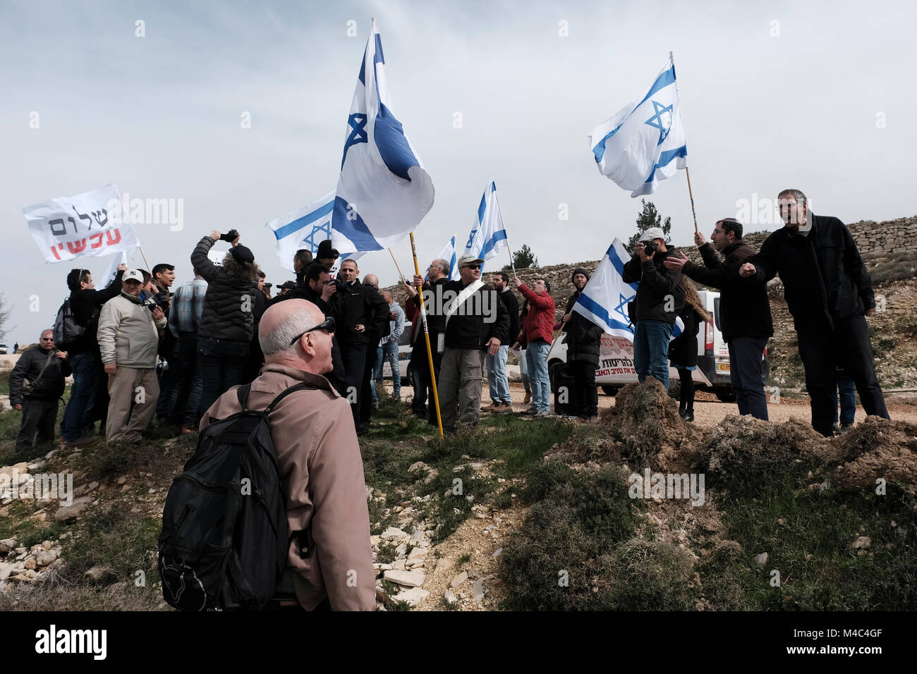 Nativ Ha'avot, Israel. 15th Feb, 2018. Jewish settlers and activists from the right wing Zionist organization Im Tirtzu confronting members of the left-wing Peace Now movement protesting next to the illegal outpost of Nativ Ha'avot on following Israeli government attempts to postpone the removal of some of the houses in the outpost despite the Supreme Court ruling after accepting the petition of a group of Palestinians who argued the homes had been partially built illegally on their land. Credit: Eddie Gerald/Alamy Live News Stock Photo