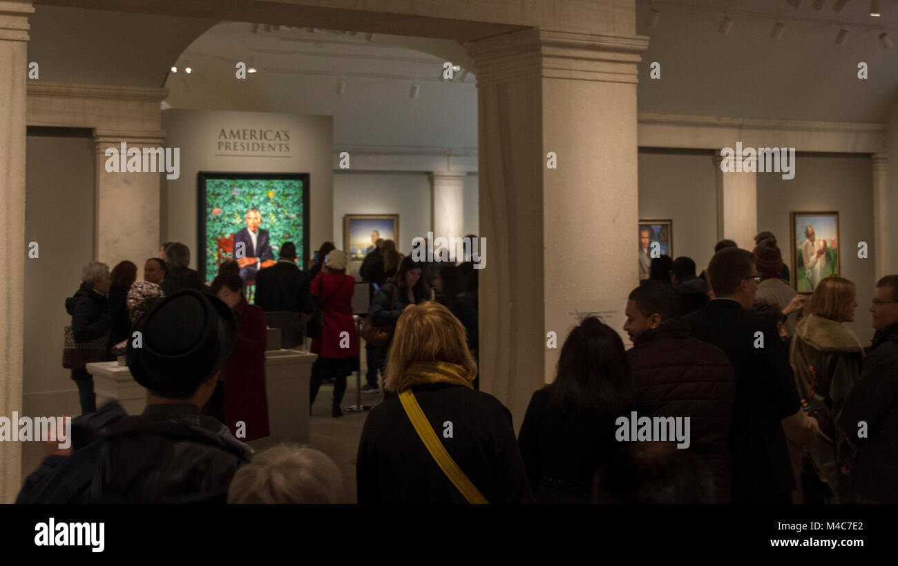 Washington, USA. 14th Feb, 2018. Crowds flock to see the new offical presidential portrait of Barack Obama at the National Portrait Gallery, Smithsonian Institution, Washington, DC. The painting, by Kehinde Wiley, was unveiled February 12, 2018. Credit: Tim Brown/Alamy Live News Stock Photo