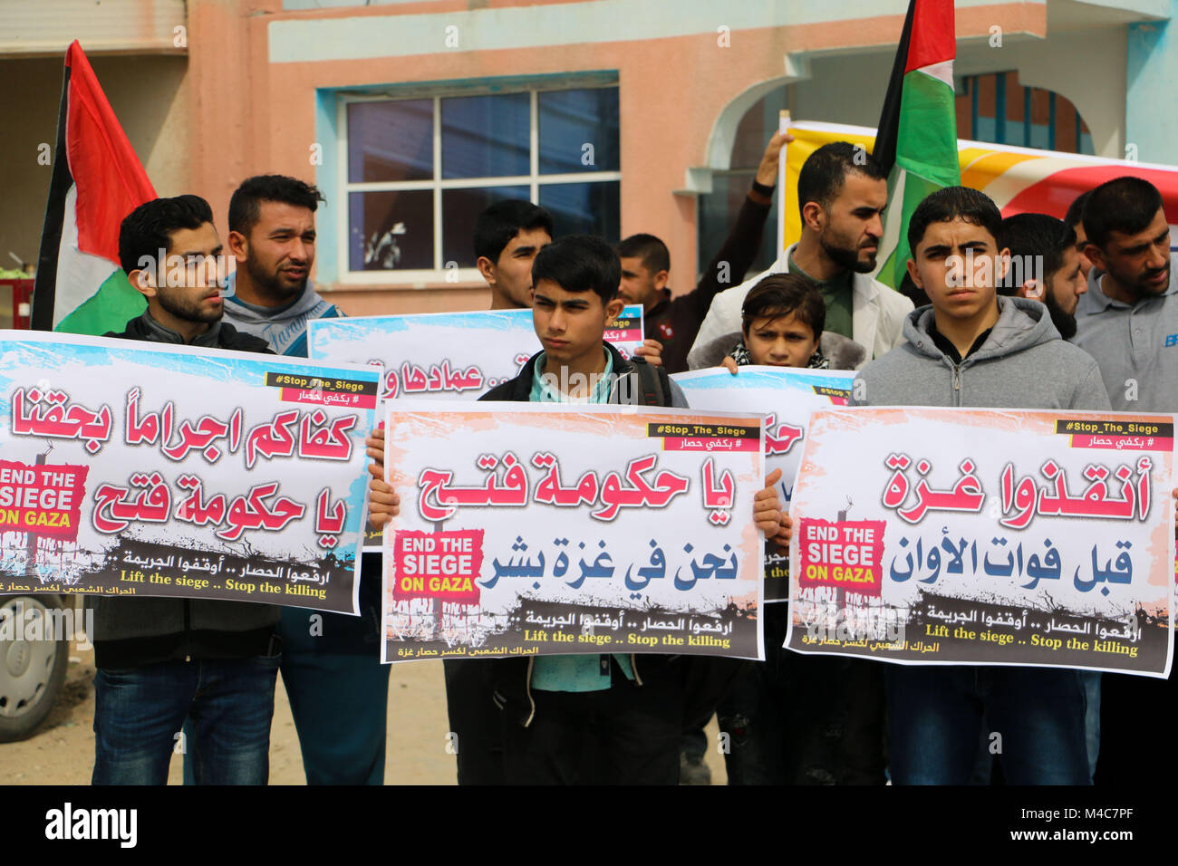 February 15, 2018 - The 'popular movement to break the siege of Gaza'' organise a protest in Beit Hanoun, at the gate of the Erez crossing between Israel and Gaza in northern Gaza, against the Israeli siege on the Gaza Strip. Protesters called for the lift of the land, sea and air blockade on Gaza which Israel has imposed on the Gaza Strip over the last decade, and for the rights of the Palestinians in Gaza to be respected, including their rights to go abroad for education purposes and medical treatments. They also demanded the lifting of the punitive administrative and financial measures i Stock Photo