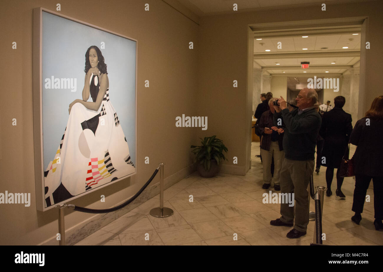 Washington, USA. 14th Feb, 2018. Visitors waited in line to view the new portrait of former First Lady Michelle Obama, at the National Portrait Gallery, Smithsonian Institution, Washington, DC. The painting, by Amy Sherald, was unveiled February 12, 2018. Credit: Tim Brown/Alamy Live News Stock Photo