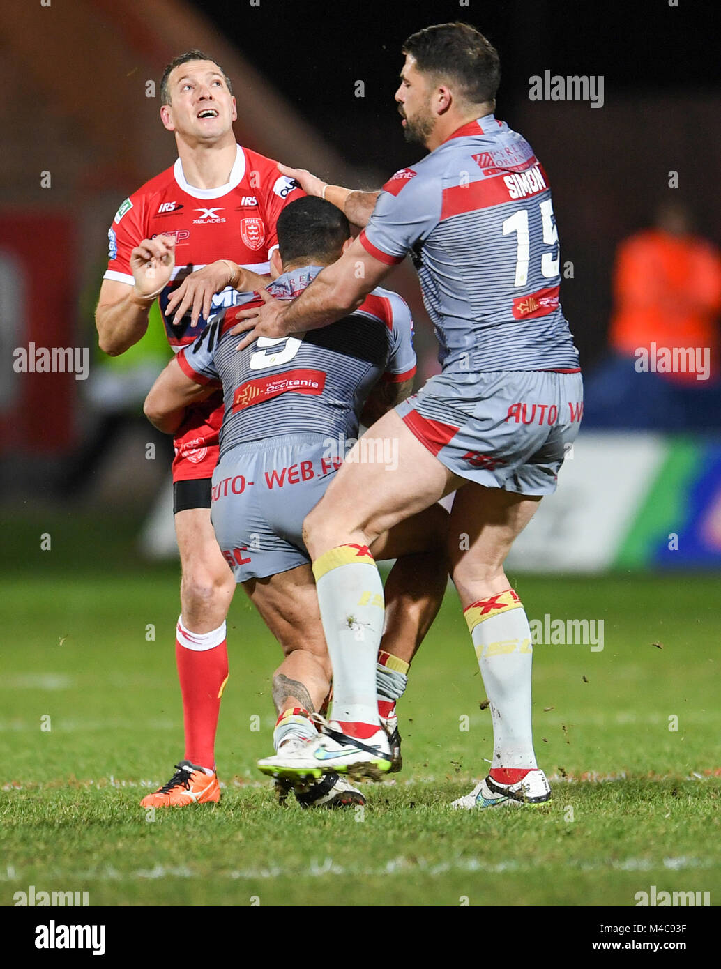 Hull, UK. 15th Feb, 2018. Hull KR’s Danny McGuire gets tackled  by Catalan Dragons' Mickael Simon and Paul Aiton during the Betfred Super League game between Hull KR and Catalans Dragons on Thursday 15th Feb 2018 at the KCOM Craven Park Credit: News Images/Alamy Live News Stock Photo
