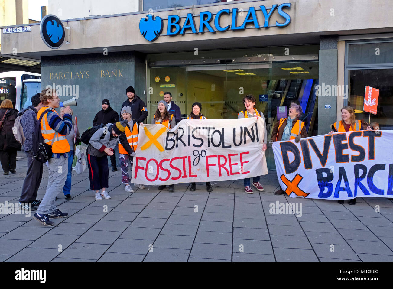 Bristol, UK. 15th Feb, 2018. Demonstrators protest against Barclays Bank’s involvement with the fossil fuel industry outside the bank’s branch in Clifton. The demonstration was organised by Fossil Free University of Bristol, a student group which campaigns for the university to break its connections with Barclays Bank. Keith Ramsey/Alamy Live News Stock Photo