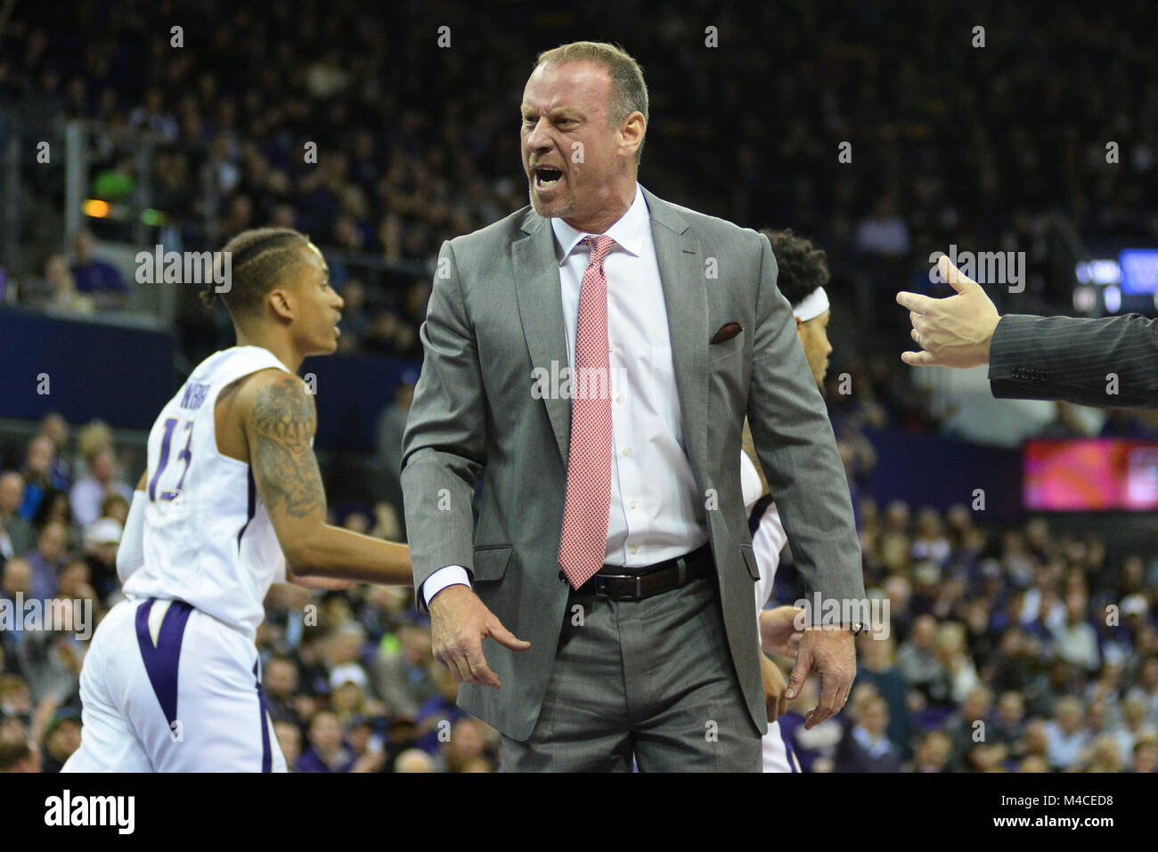 Seattle, WA, USA. 15th Feb, 2018. Utah Head Coach Larry Krystkowiak tries to get the referee's attention during a time out in a PAC12 basketball game between the University of Washington and the University of Utah. The game was played at Hec Ed Pavilion in Seattle, WA. Jeff Halstead/CSM/Alamy Live News Stock Photo