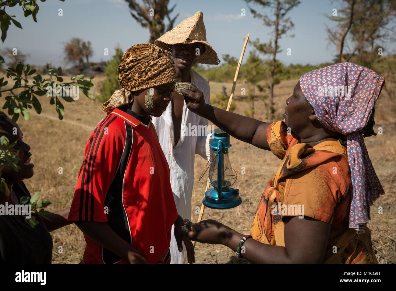 Uganda. 2nd Feb, 2018. Young men and women from the Sebei tribe in Kapchorwa, northeast Uganda, reenact the ceremony they'd go through before circumcision or female genital mutilation (FGM). Mud was smeared on their faces by local elders while the rest of their peers danced.Female genital mutilation (FGM) has been outlawed in Uganda since 2010, but aid workers and police say it's still being practiced by tribes in the northeast, including the Pokots, Sebei, Tepeth and Kadama. Credit: Sally Hayden/SOPA/ZUMA Wire/Alamy Live News Stock Photo