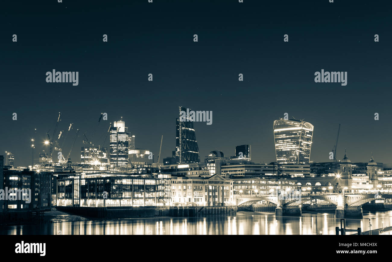 London skyline and Thames at night. Stock Photo