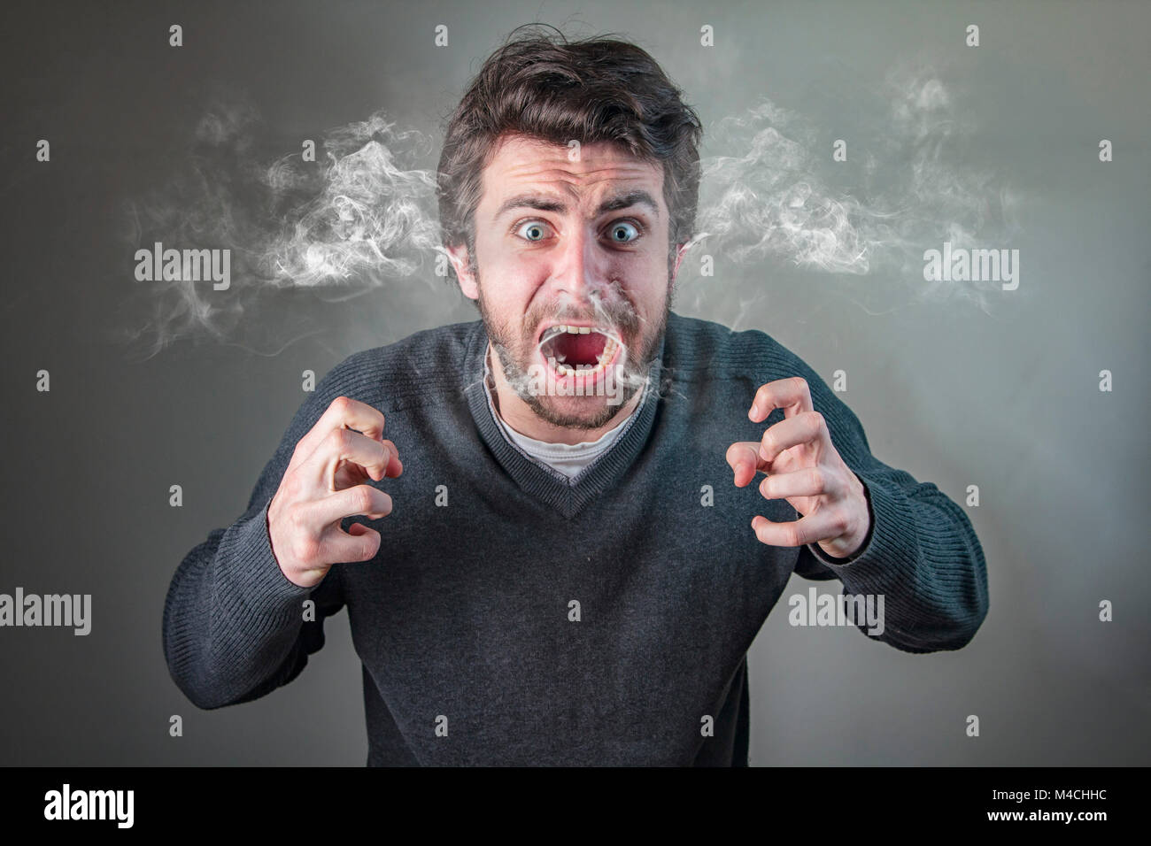 Furious man steaming with rage Stock Photo