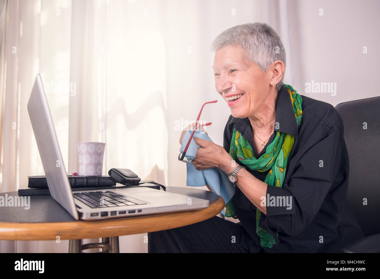 Cheerful senior business woman Stock Photo