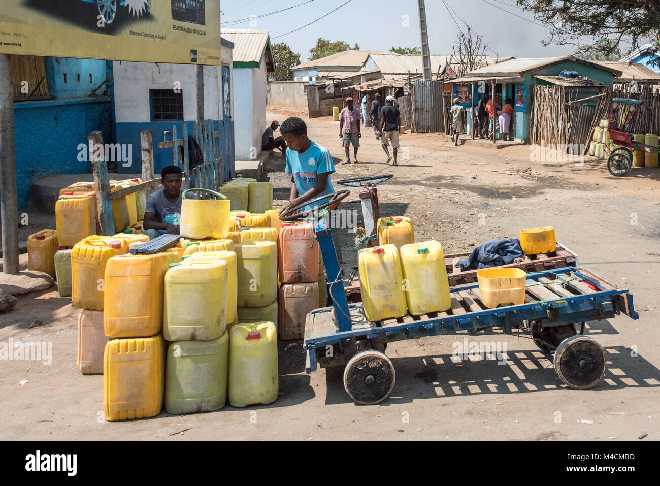 Water Distribution in Containers, southern Madagascar Stock Photo