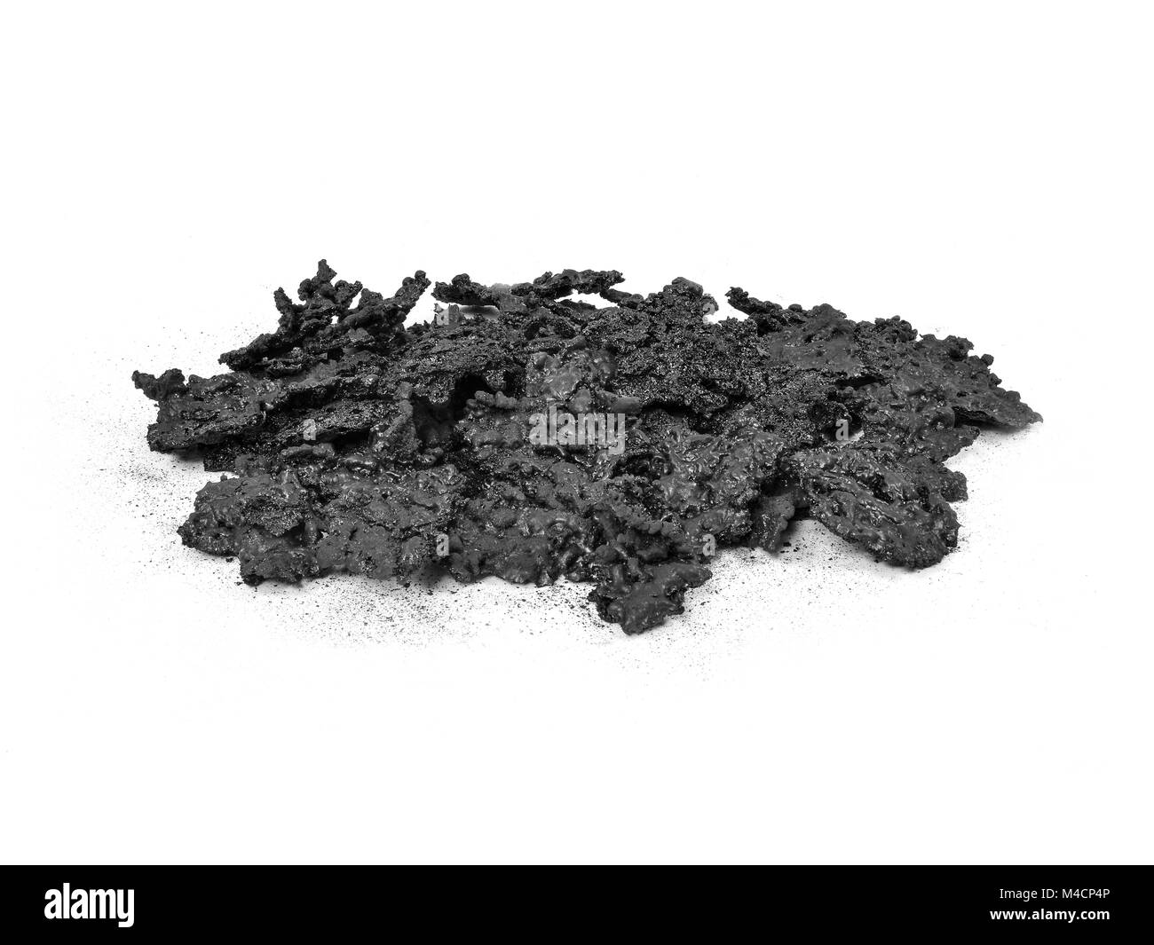 Pile of Creosote accumulation that was removed from a Wood Stove Chimney during Stove Pipe Cleaning. Stock Photo