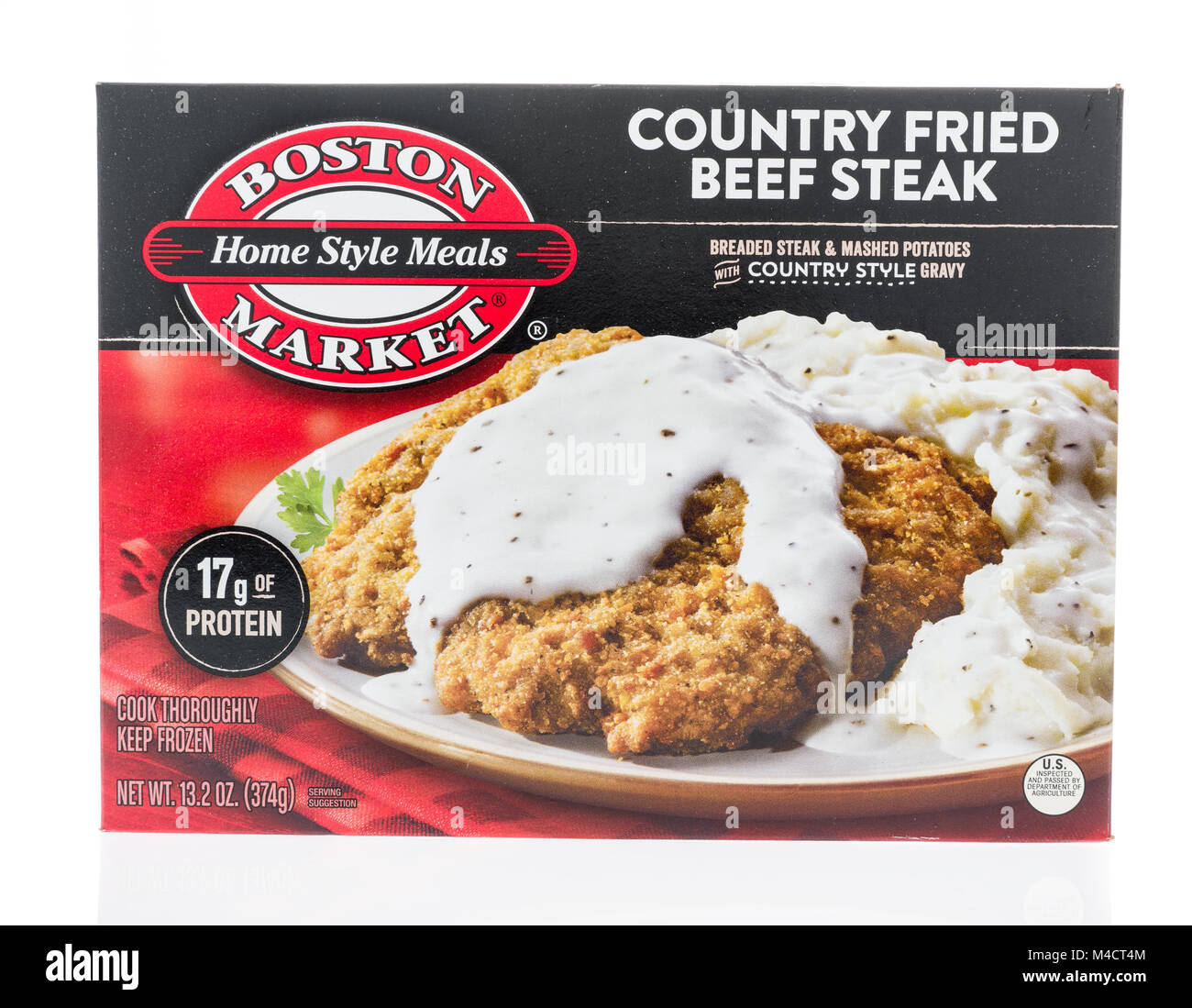 Winneconne, WI - 10 February 2018: A box of Boston Market home style meals in country fried beef steak on an isolated background. Stock Photo