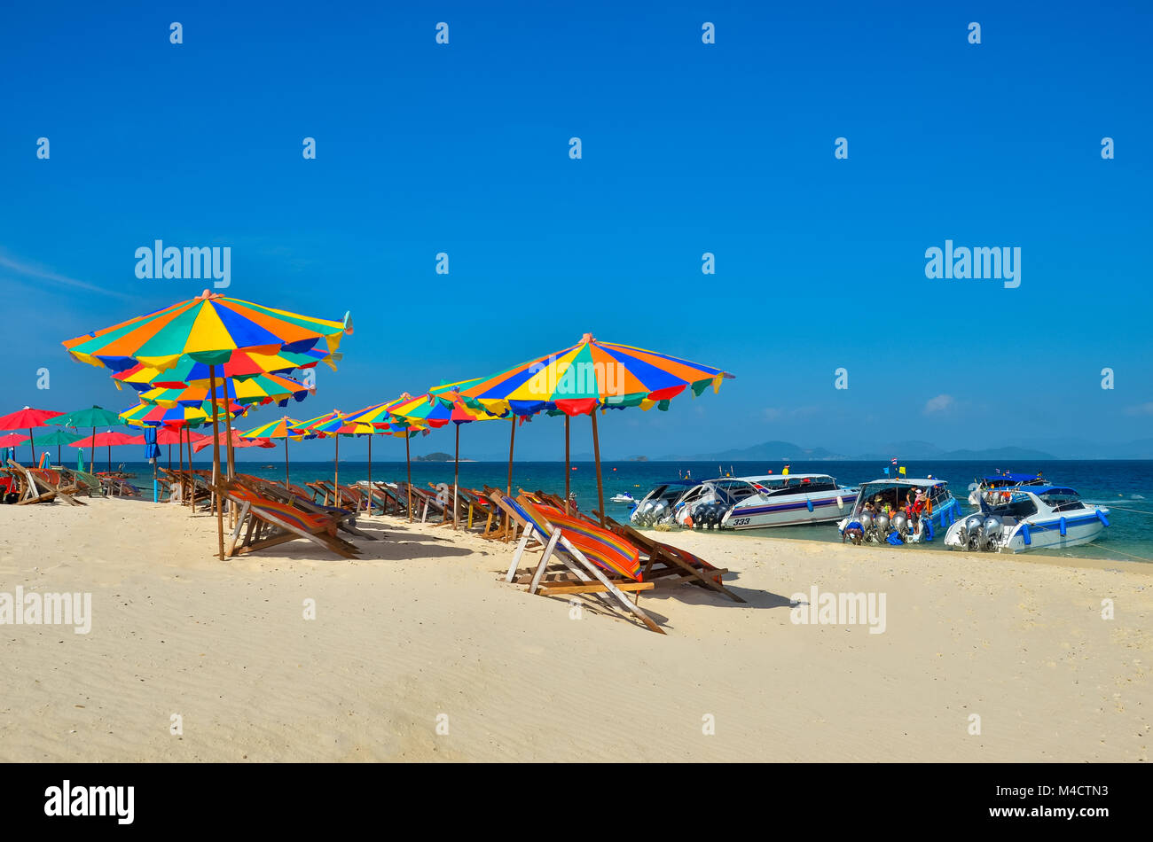 Sea,Island,umbrella,Thailand, Khai Island Phuket, Sun beds and sun umbrellas on a tropical beach Stock Photo