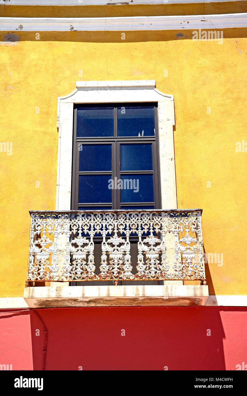 Traditional Portuguese building with a wrought iron balcony in the old town, Portimao, Algarve, Portugal, Europe. Stock Photo