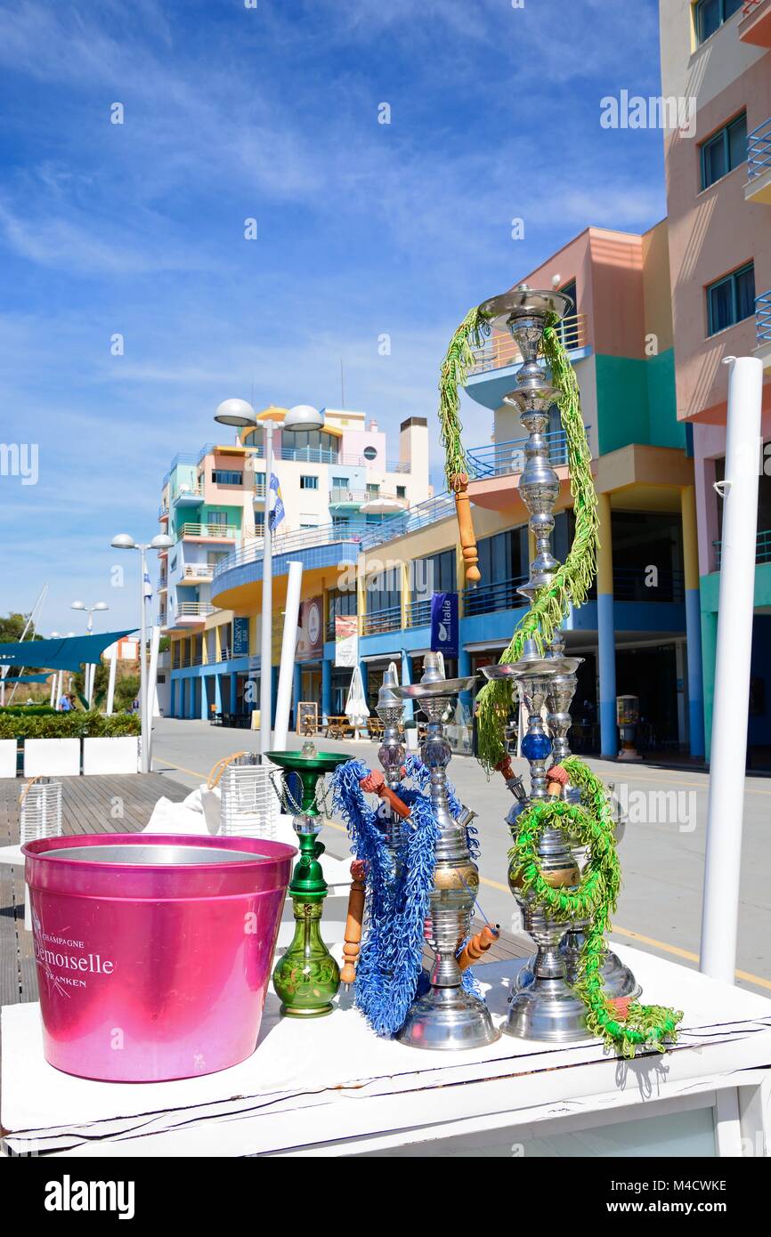Hookah pipes at a waterfront restaurant in the marina with buildings to the rear, Albufeira
