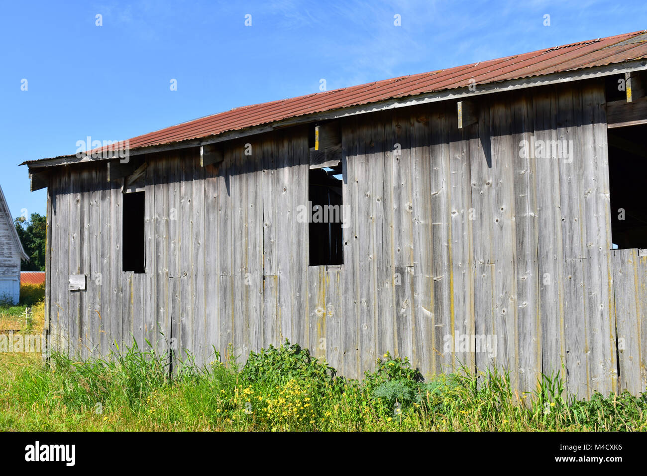 Weathered and worn old barn storage facility at a rural countryside