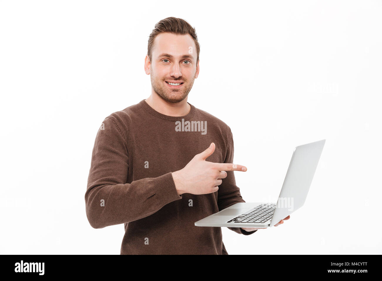 Image of smiling young man standing isolated over white background ...
