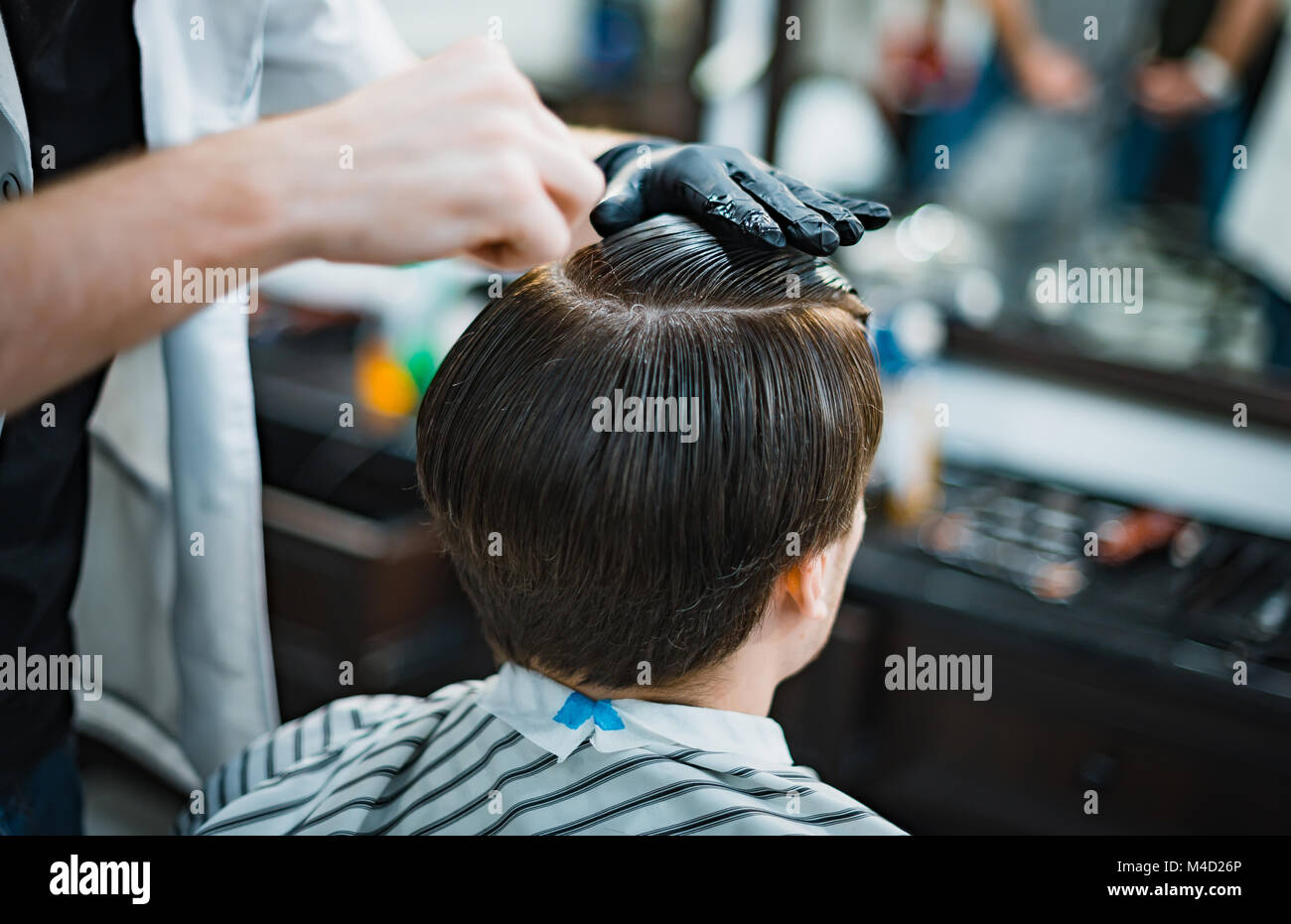 Hairdresser makes hairstyle electric razor hi-res stock photography and ...