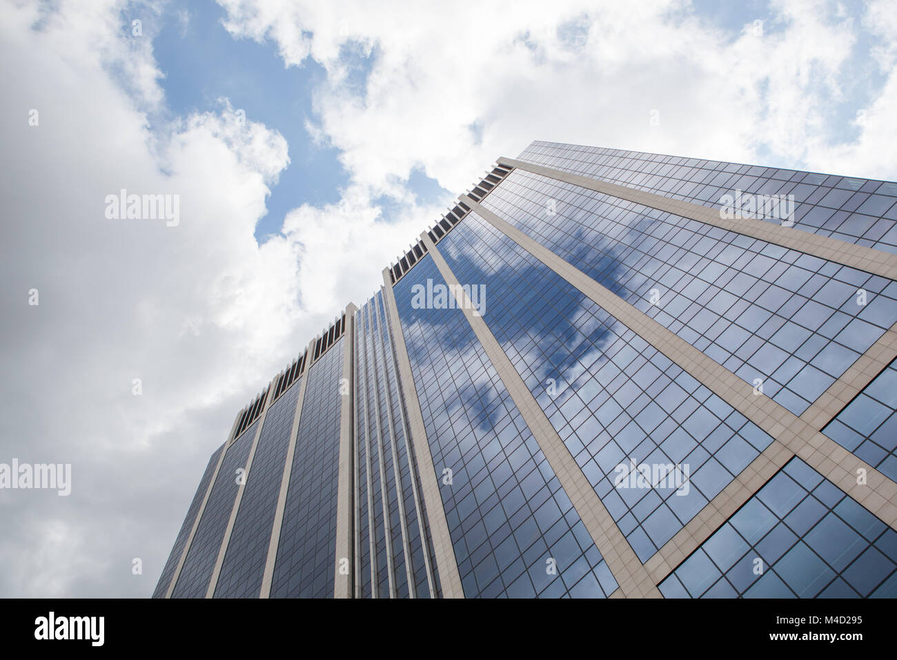clouds reflected in windows of modern office building Stock Photo - Alamy