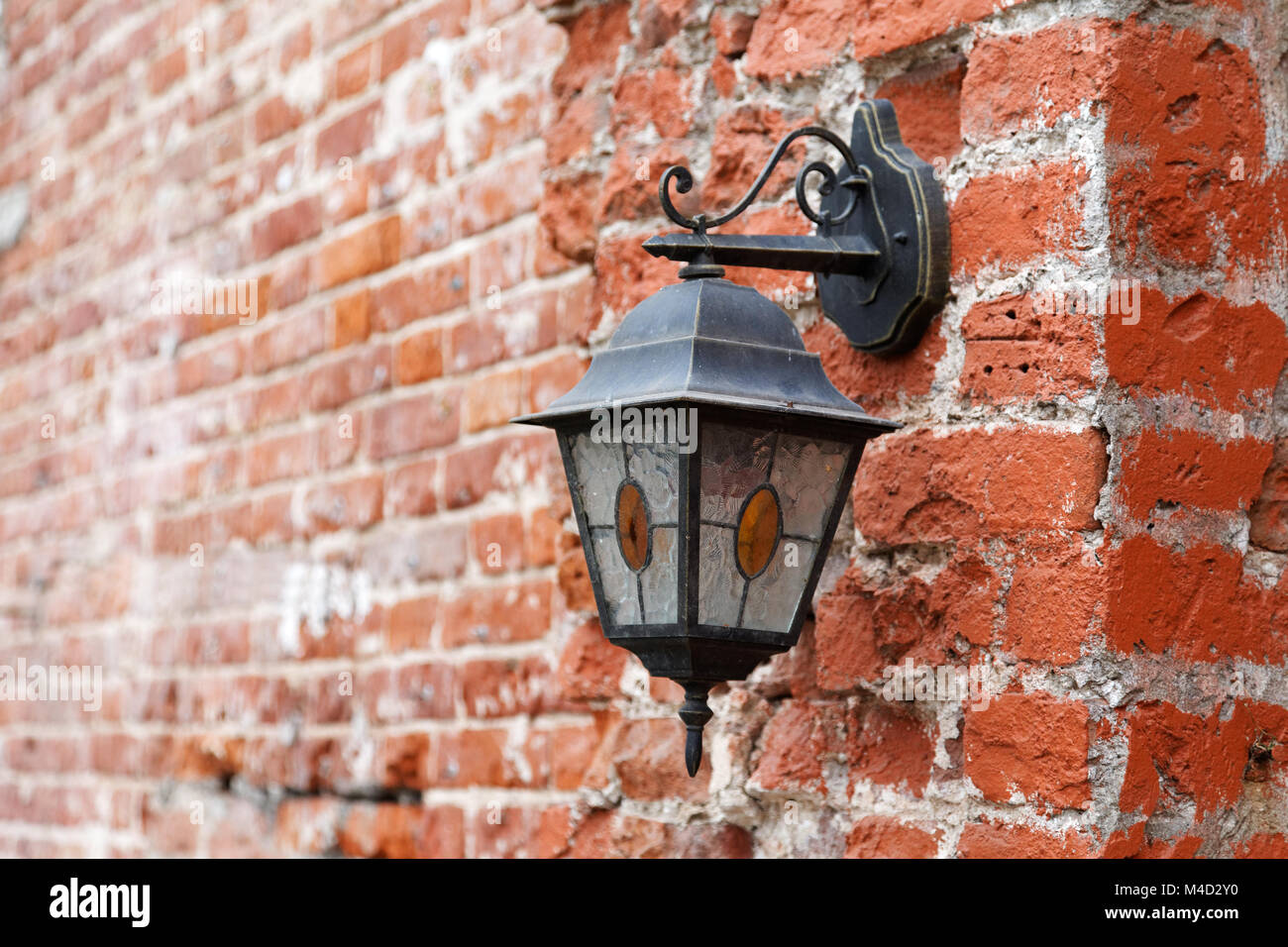 Vintage lantern on old red brick wall Stock Photo