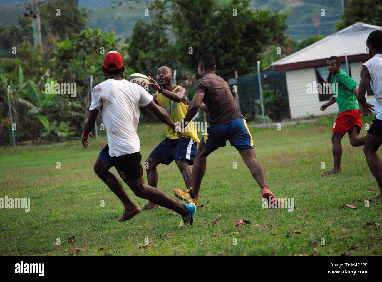 Fijian men playing rugby, Rakiraki playing field, Fiji. Stock Photo