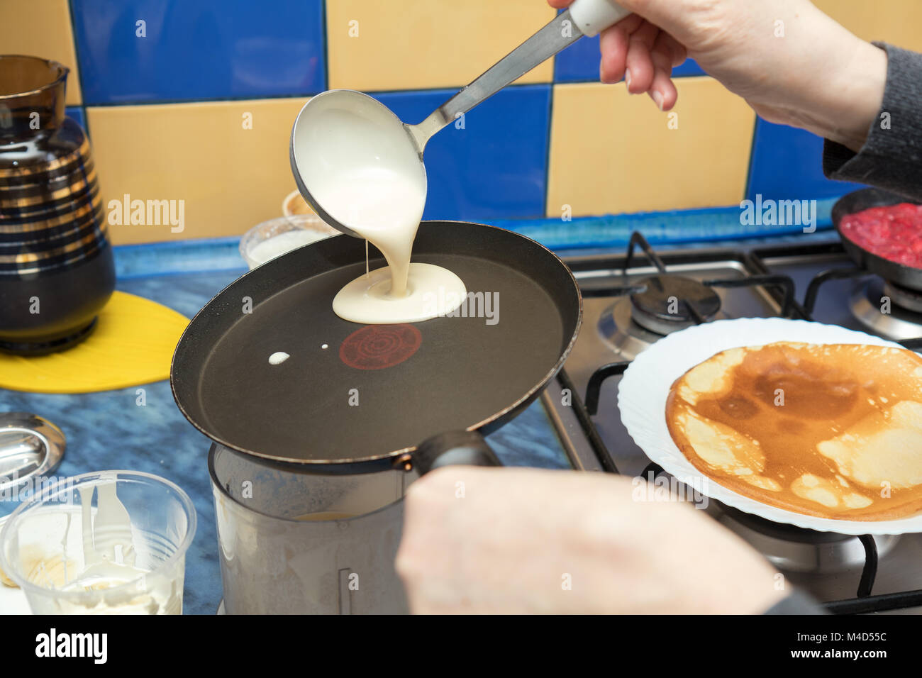 The process of cooking pancakes on a hot skillet Stock Photo Alamy