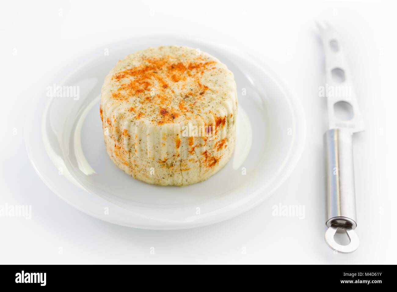 Home-made cheese with a cheese knife Stock Photo