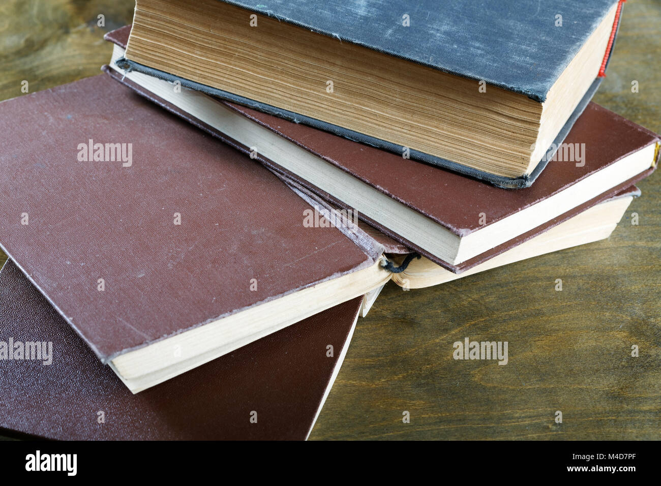 old books in brown cover close up Stock Photo